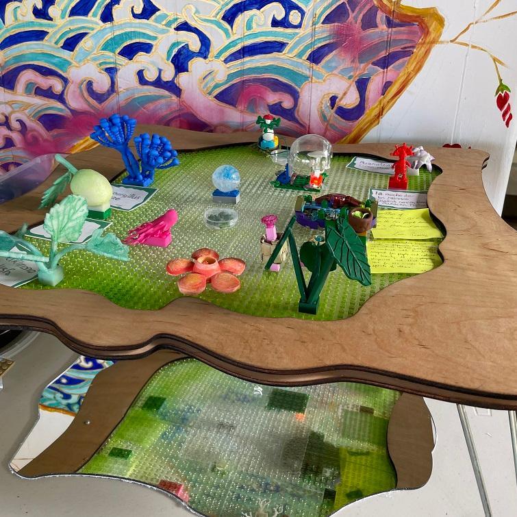Art installation titled Floating Kipula by Corinne Takara featuring mixed media elements.