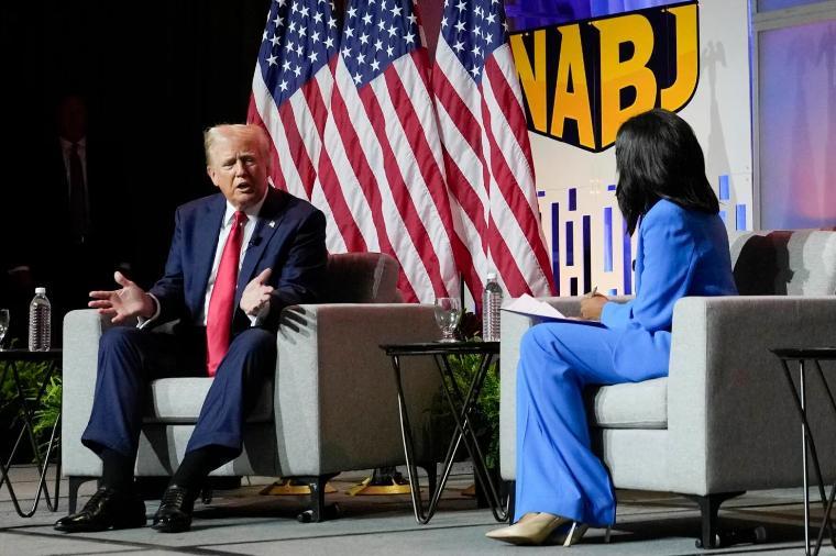 Republican presidential candidate former President Donald Trump, left, moderated by ABCs Rachel Scott, speaks at the National Association of Black Journalists convention, July 31, 2024, in Chicago.