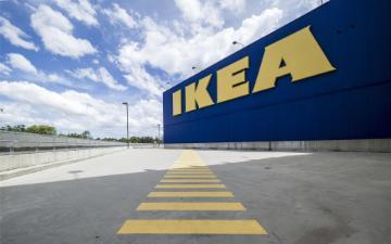 Empty garage with a highlighted walking path in front of an IKEA. 