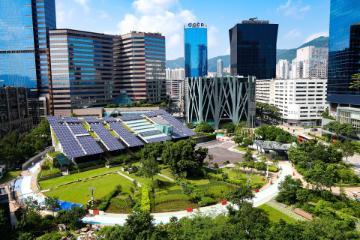 A structure with solar panels in the city.