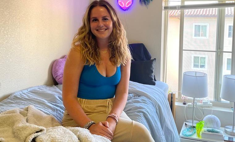 Charlie Johnson 26 in her dorm room at Casa Italiana Apartments.