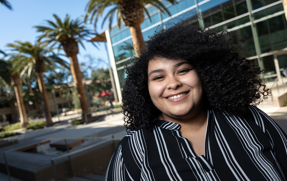 Rachel Stattion stands in the Sobrato courtyard outside of SCDI