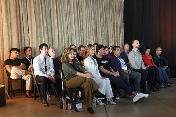 All of the demo day presenters sitting together