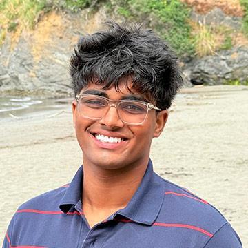 Young man outdoors smiling
