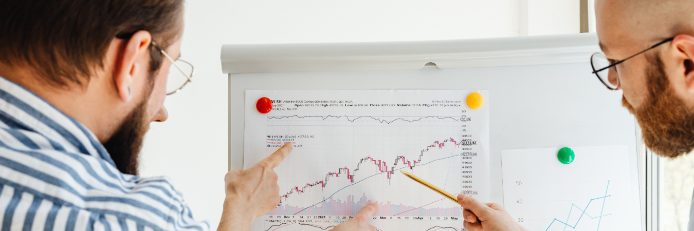 Business professionals analyzing stock performance