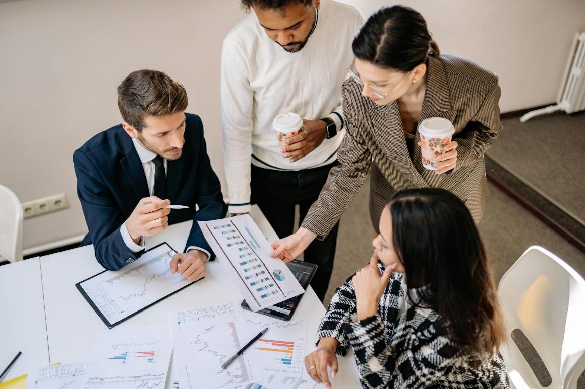 Finance professionals discussing charts
