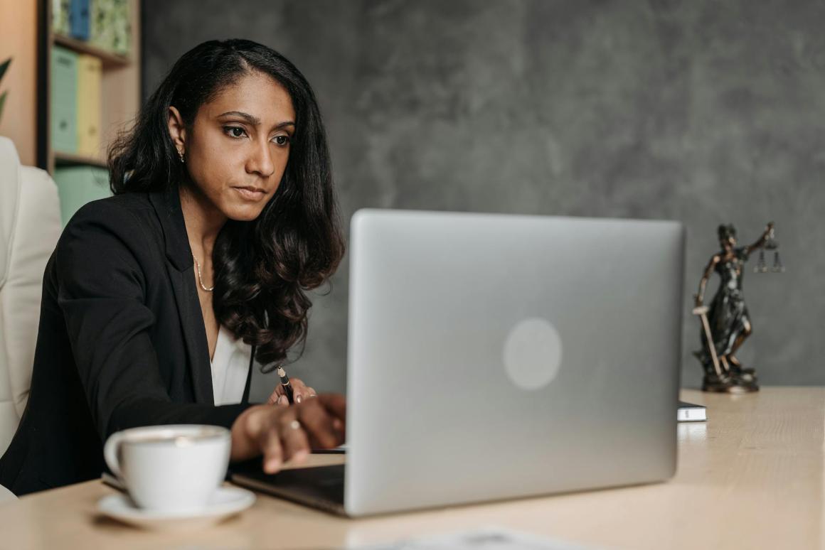 Business professional on a laptop in office