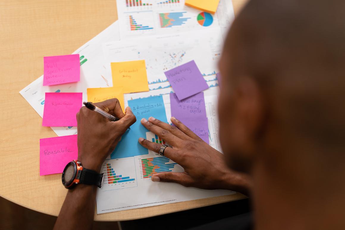 Prospective student using colorful notes to organize thoughts