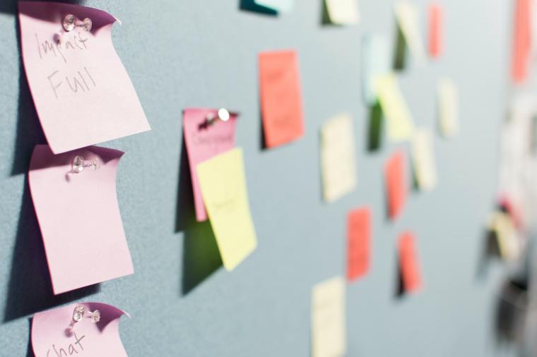 post-its on bulletin board 