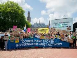 Protesters carry banners saying Governments have spoken, we must do something about climate change now