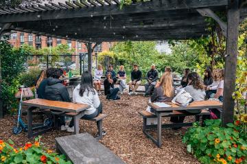 kristin teaching grief cycle with tanbark chips in forge garden