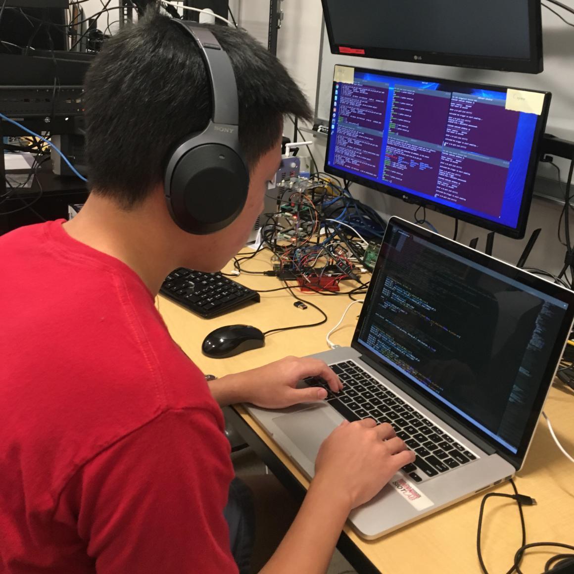Simon Liu 20 at work in the SCU Internet of Things Laboratory image link to story