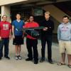 From left, Robert Llanos-Hinson, Thomas Clark, Siosiua Faleta, Micah Klaeser, and Michael Dewane with a portion of their prototype.